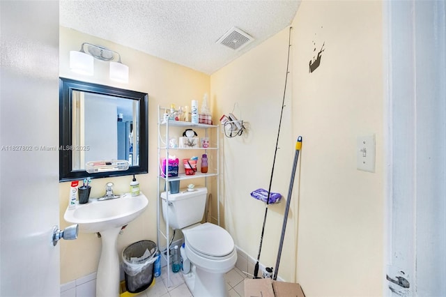 1178 NW 123rd Pl Unit 1210, Miami, FL 33182 - half bath featuring a textured ceiling and tile patterned floors
