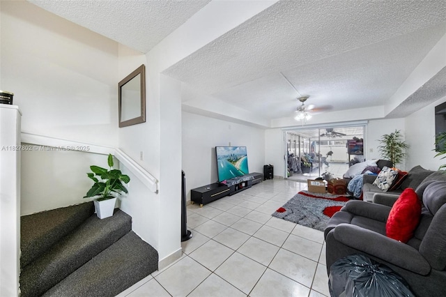 1178 NW 123rd Pl Unit 1210, Miami, FL 33182 - living area with a textured ceiling, light tile patterned flooring, ceiling fan, and stairway