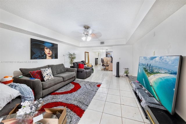 1178 NW 123rd Pl Unit 1210, Miami, FL 33182 - living area featuring ceiling fan, a tray ceiling, tile patterned floors, and a textured ceiling