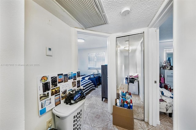 1178 NW 123rd Pl Unit 1210, Miami, FL 33182 - hallway with tile patterned floors and a textured ceiling