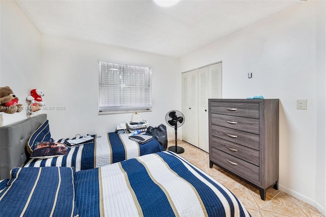 1178 NW 123rd Pl Unit 1210, Miami, FL 33182 - bedroom with light tile patterned floors and a closet