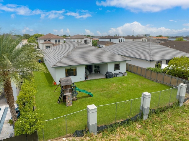 14832 SW 39th Ter, Miami, FL 33185 - rear view of house with a fenced backyard, stucco siding, a patio area, and a residential view
