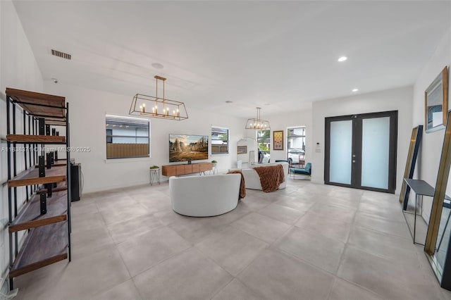 14832 SW 39th Ter, Miami, FL 33185 - living room with french doors, a chandelier, and recessed lighting