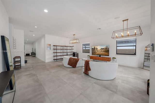 14832 SW 39th Ter, Miami, FL 33185 - living area featuring a chandelier, recessed lighting, and concrete flooring