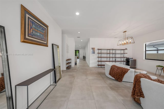 14832 SW 39th Ter, Miami, FL 33185 - corridor featuring recessed lighting, a chandelier, and concrete flooring