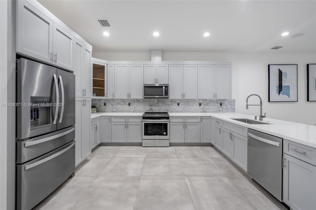 14832 SW 39th Ter, Miami, FL 33185 - kitchen with stainless steel appliances, decorative backsplash, and recessed lighting