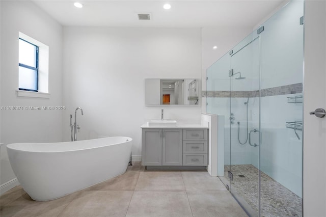 14832 SW 39th Ter, Miami, FL 33185 - bathroom featuring a soaking tub, a stall shower, vanity, and recessed lighting