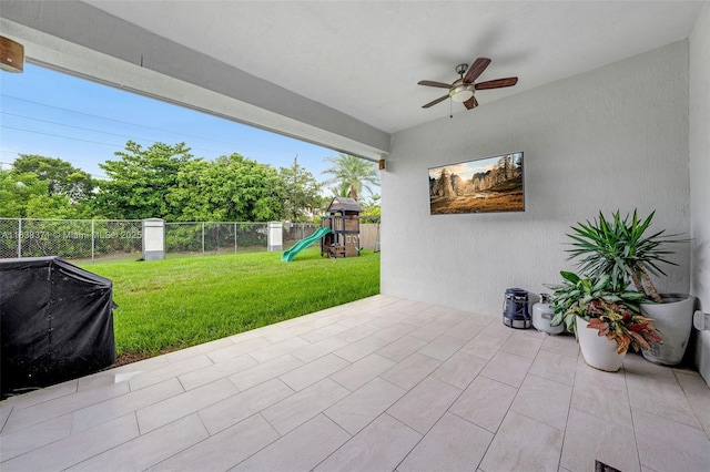 14832 SW 39th Ter, Miami, FL 33185 - fenced backyard with a playground, a ceiling fan, and a patio area