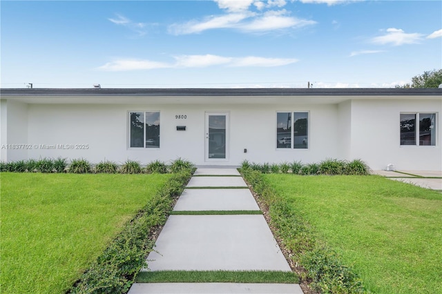 9800 SW 159th St, Miami, FL 33157 - view of front of home featuring stucco siding and a front lawn