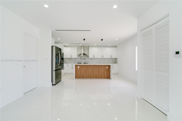 9800 SW 159th St, Miami, FL 33157 - kitchen featuring stainless steel refrigerator with ice dispenser, wall chimney exhaust hood, decorative backsplash, white cabinets, and light countertops