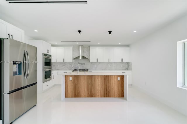 9800 SW 159th St, Miami, FL 33157 - kitchen with stainless steel appliances, wall chimney exhaust hood, decorative backsplash, light countertops, and recessed lighting