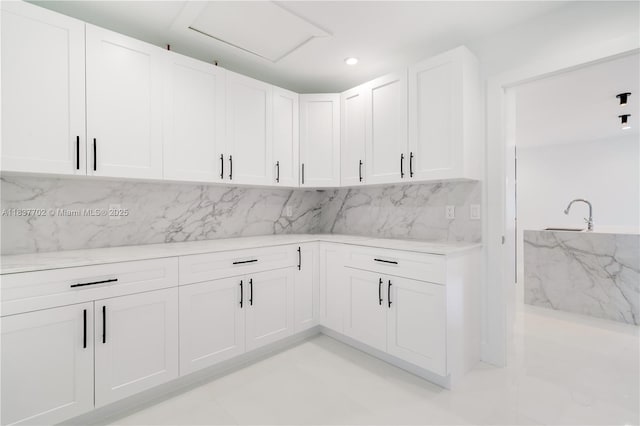 9800 SW 159th St, Miami, FL 33157 - kitchen with backsplash, white cabinets, recessed lighting, and light stone counters