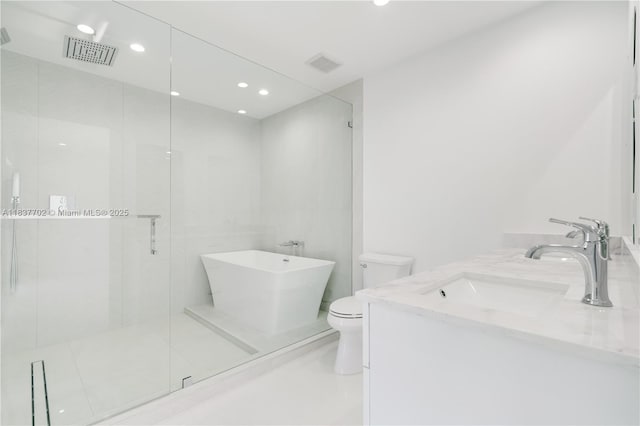 9800 SW 159th St, Miami, FL 33157 - bathroom with double vanity, a freestanding tub, a shower stall, and recessed lighting