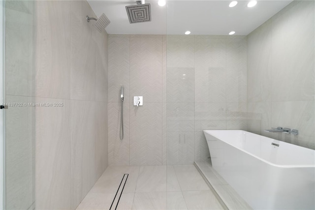 9800 SW 159th St, Miami, FL 33157 - bathroom featuring a tile shower, a soaking tub, recessed lighting, and tile patterned floors