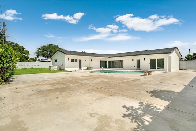 9800 SW 159th St, Miami, FL 33157 - back of property with stucco siding and a patio area