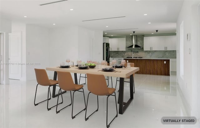 9800 SW 159th St, Miami, FL 33157 - kitchen featuring wall chimney range hood, fridge, backsplash, recessed lighting, and white cabinets