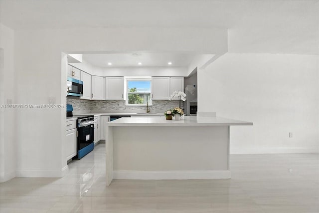 6424 Pierce St, Hollywood, FL 33024 - kitchen with stainless steel appliances, white cabinetry, tasteful backsplash, light countertops, and recessed lighting