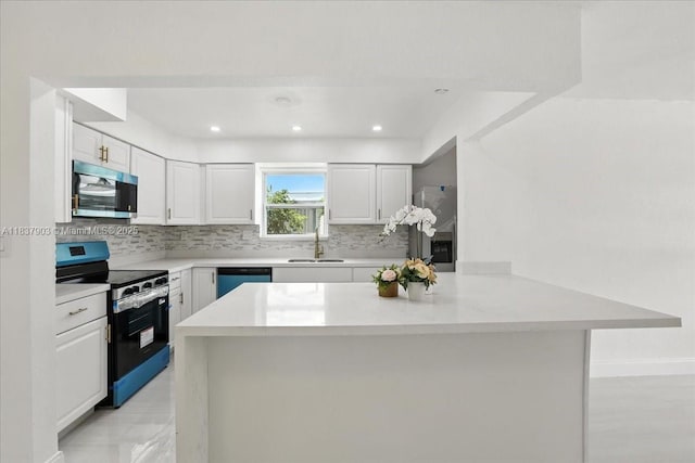 6424 Pierce St, Hollywood, FL 33024 - kitchen featuring stainless steel appliances, a peninsula, decorative backsplash, light countertops, and white cabinets