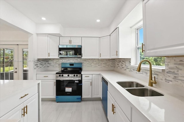 6424 Pierce St, Hollywood, FL 33024 - kitchen featuring stainless steel appliances, light countertops, tasteful backsplash, white cabinets, and recessed lighting