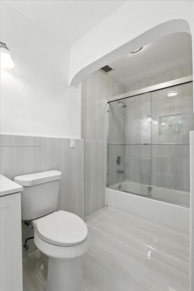 6424 Pierce St, Hollywood, FL 33024 - full bath with shower / bath combination with glass door, vanity, tile walls, and tile patterned floors
