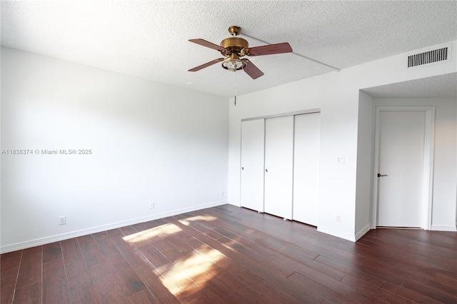 10140 W Bay Harbor Dr Unit 201A, Bay Harbor Islands, FL 33154 - unfurnished bedroom featuring wood finished floors, a closet, a ceiling fan, and a textured ceiling