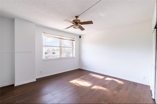 10140 W Bay Harbor Dr Unit 201A, Bay Harbor Islands, FL 33154 - empty room with a ceiling fan, dark wood finished floors, and a textured ceiling