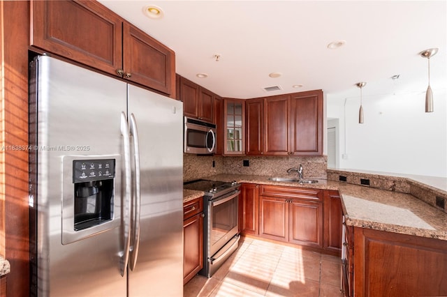 10140 W Bay Harbor Dr Unit 201A, Bay Harbor Islands, FL 33154 - kitchen with stainless steel appliances, light stone counters, glass insert cabinets, light tile patterned floors, and decorative backsplash