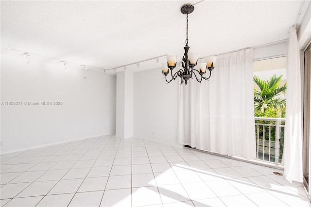 10140 W Bay Harbor Dr Unit 201A, Bay Harbor Islands, FL 33154 - unfurnished room featuring a chandelier and track lighting