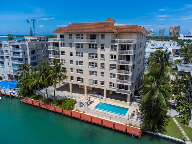 10140 W Bay Harbor Dr Unit 201A, Bay Harbor Islands, FL 33154 - view of apartment building / complex with a water view and a community pool