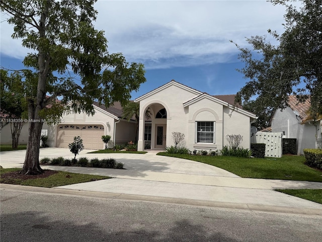 794 Lake Blvd, Weston, FL 33326 - view of front of home with driveway, a front lawn, stucco siding, and a garage
