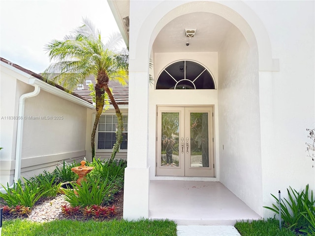 794 Lake Blvd, Weston, FL 33326 - view of exterior entry with french doors and stucco siding