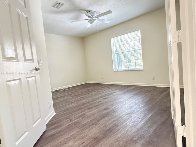 794 Lake Blvd, Weston, FL 33326 - unfurnished bedroom featuring dark wood-style flooring, a ceiling fan, and a textured ceiling