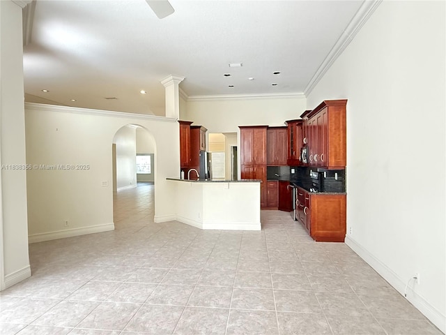 794 Lake Blvd, Weston, FL 33326 - kitchen with arched walkways, freestanding refrigerator, crown molding, open floor plan, and dark countertops