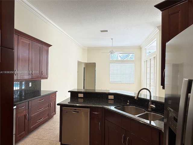 794 Lake Blvd, Weston, FL 33326 - kitchen featuring freestanding refrigerator, stainless steel dishwasher, a ceiling fan, crown molding, and dark stone counters