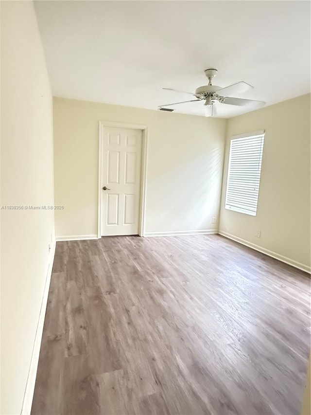 794 Lake Blvd, Weston, FL 33326 - empty room featuring a ceiling fan and wood finished floors