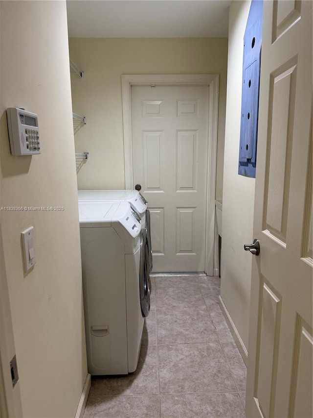794 Lake Blvd, Weston, FL 33326 - laundry area featuring washing machine and dryer and light tile patterned flooring