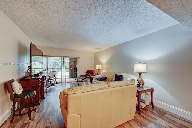 23344 Carolwood Ln Unit 303, Boca Raton, FL 33428 - living area with a textured ceiling and wood finished floors