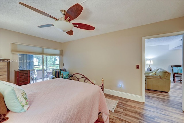 23344 Carolwood Ln Unit 303, Boca Raton, FL 33428 - bedroom with wood finished floors, access to outside, a textured ceiling, and a ceiling fan