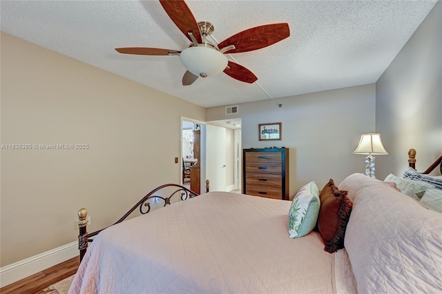 23344 Carolwood Ln Unit 303, Boca Raton, FL 33428 - bedroom with wood finished floors, a textured ceiling, and a ceiling fan
