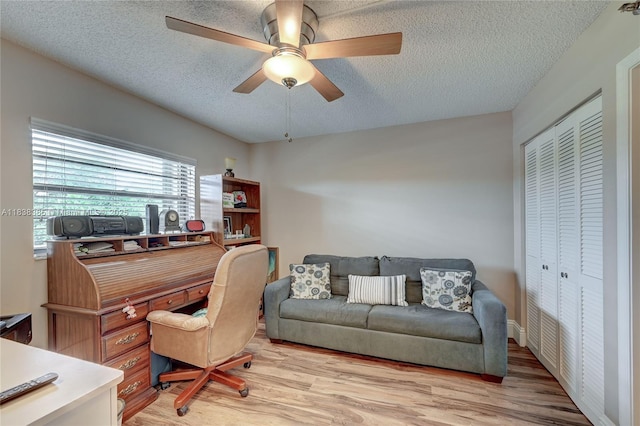23344 Carolwood Ln Unit 303, Boca Raton, FL 33428 - home office featuring light wood-style floors, ceiling fan, and a textured ceiling