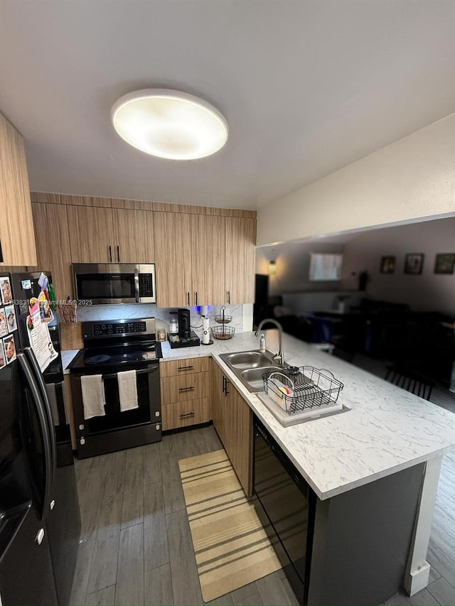 575 W Park Dr Unit 202, Miami, FL 33172 - kitchen with black appliances, a peninsula, light countertops, and modern cabinets