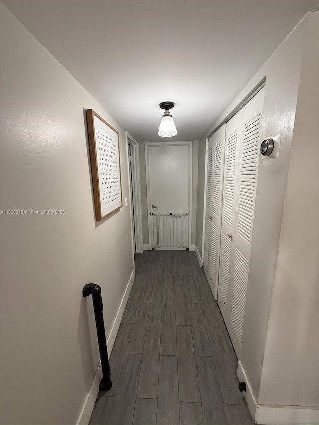 575 W Park Dr Unit 202, Miami, FL 33172 - corridor featuring dark wood finished floors and baseboards