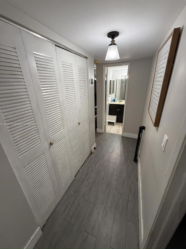 575 W Park Dr Unit 202, Miami, FL 33172 - corridor with baseboards and dark wood-type flooring