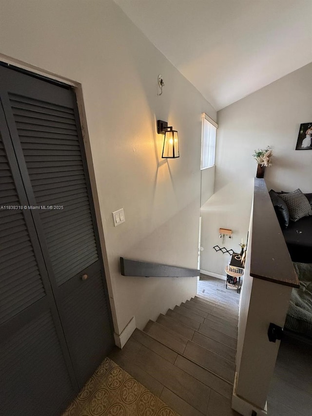 575 W Park Dr Unit 202, Miami, FL 33172 - staircase with wood finished floors and vaulted ceiling