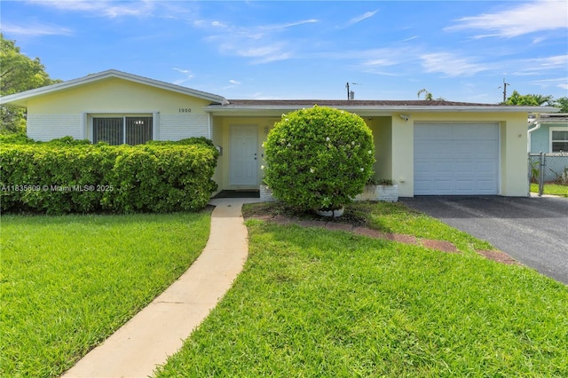 1900 N 31st Ave, Hollywood, FL 33021 - single story home featuring a garage, stucco siding, driveway, and brick siding