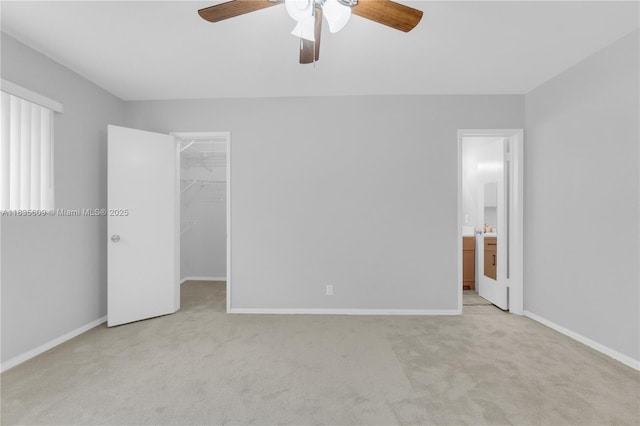 1900 N 31st Ave, Hollywood, FL 33021 - unfurnished bedroom with carpet, a spacious closet, ceiling fan, and ensuite bathroom