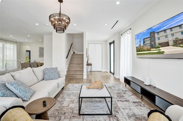 1617 NE 11th St Unit 1, Fort Lauderdale, FL 33304 - living room with stairway, recessed lighting, wood finished floors, and a chandelier