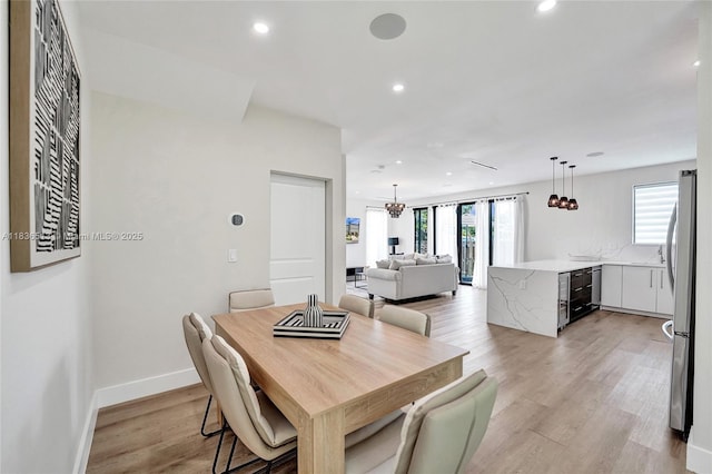 1617 NE 11th St Unit 1, Fort Lauderdale, FL 33304 - dining room with recessed lighting, light wood-type flooring, and wine cooler