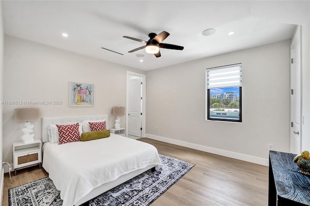 1617 NE 11th St Unit 1, Fort Lauderdale, FL 33304 - bedroom with light wood finished floors, recessed lighting, and ceiling fan