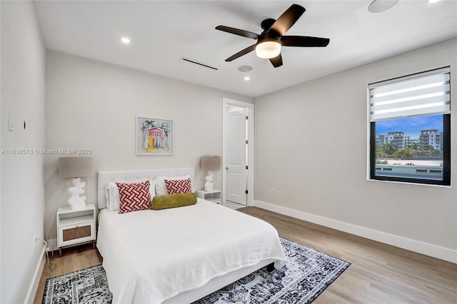 1617 NE 11th St Unit 1, Fort Lauderdale, FL 33304 - bedroom featuring wood finished floors, recessed lighting, and a ceiling fan